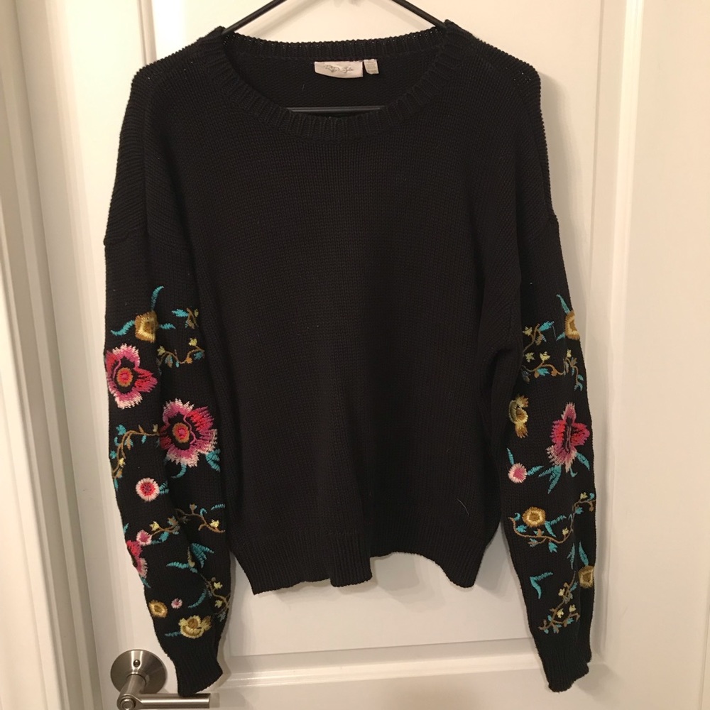 Black knit sweater with embroidered sleeves